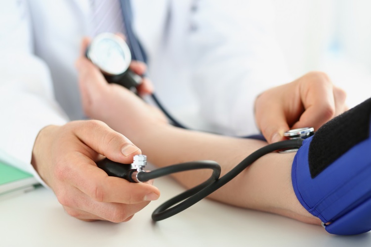 Blood pressure being measured with a cuff
