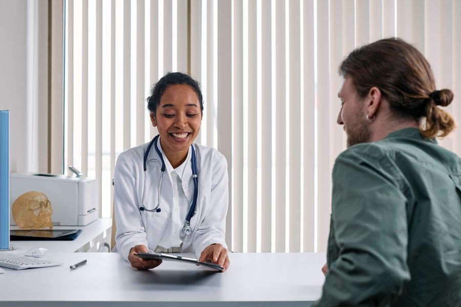 Physician consulting with a patient about women's health
