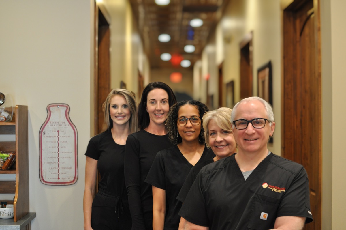 Dr. Mazza and staff in the office hallway